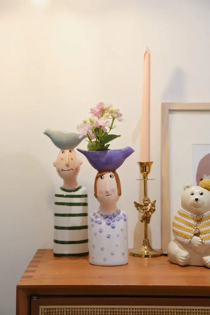 DecorBites™ ceramic vase set featuring a purple ceramic vase shaped like a woman with polka dots for home decor