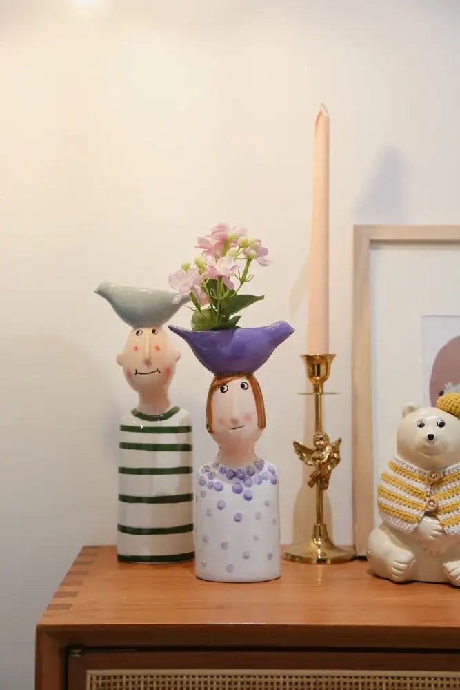 DecorBites™ ceramic vase set featuring a purple ceramic vase shaped like a woman with polka dots for home decor