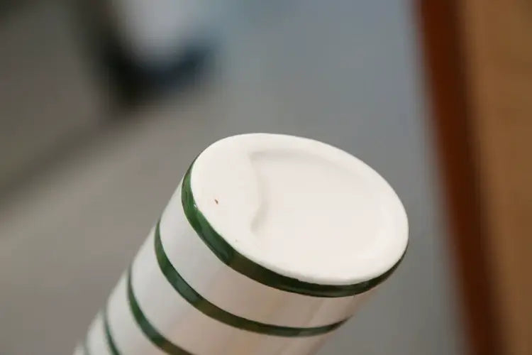 White ceramic vase with green horizontal stripes from decorbites ceramic vase set for elegant home decor display
