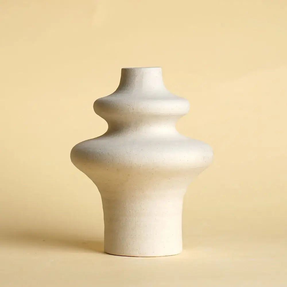 Minimalist white ceramic vase with sculpted layered form and subtle texture from decorbites ceramic vases set for home decor
