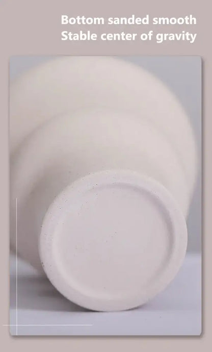 White ceramic vases from DecorBites™ set with smooth sanded bottoms for stability ideal for modern home decor
