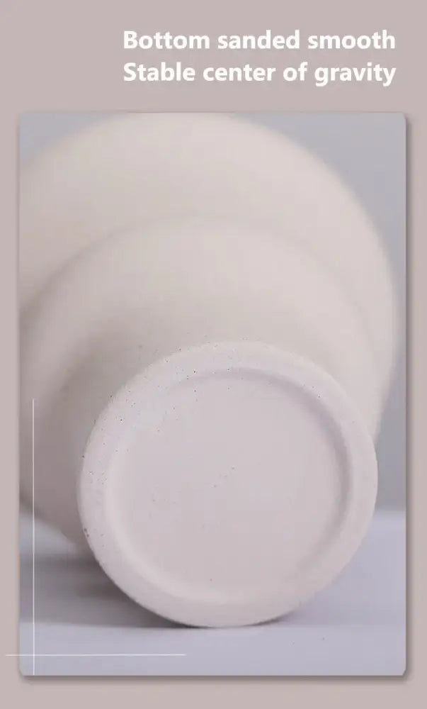 White ceramic vases from DecorBites™ set with smooth sanded bottoms for stability ideal for modern home decor
