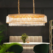 Gold-toned decorbites champagne crystal prism island pendant with cascading clear crystal prisms and textured rope chains