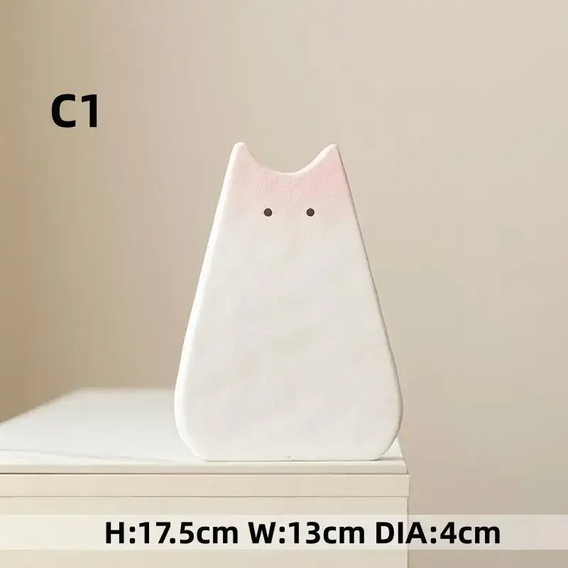 DecorBites™ charming cat ceramic vase is a minimalist white ceramic vase with a soft pink gradient for living room decor
