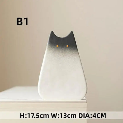 DecorBites™ charming cat-inspired ceramic vase with sleek black-to-white gradient and golden eyes for living room decor