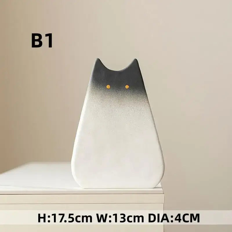 DecorBites™ charming cat-inspired ceramic vase with sleek black-to-white gradient and golden eyes for living room decor