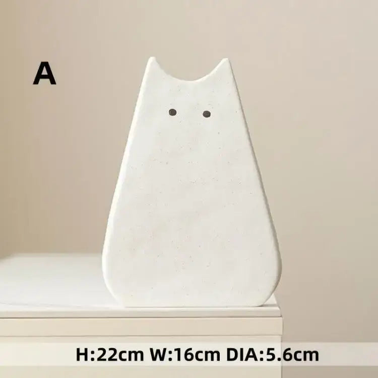 DecorBites™ charming cat-inspired white ceramic vase with minimalist design and black dot eyes for living room decor
