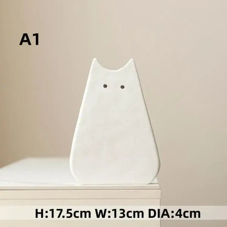 DecorBites™ charming cat-inspired white ceramic vase with minimalist black dot eyes perfect for living room decor