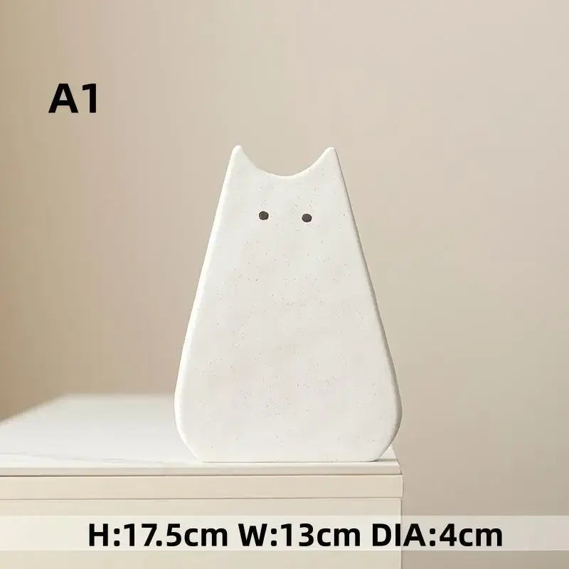 DecorBites™ charming white ceramic cat-shaped vase with minimalist black dot eyes perfect for living room decor