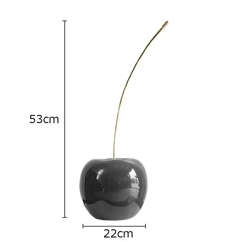 Decorbites™ cherry fruit sculpture is a glossy black ceramic fruit sculpture with a slender gold stem for modern decor