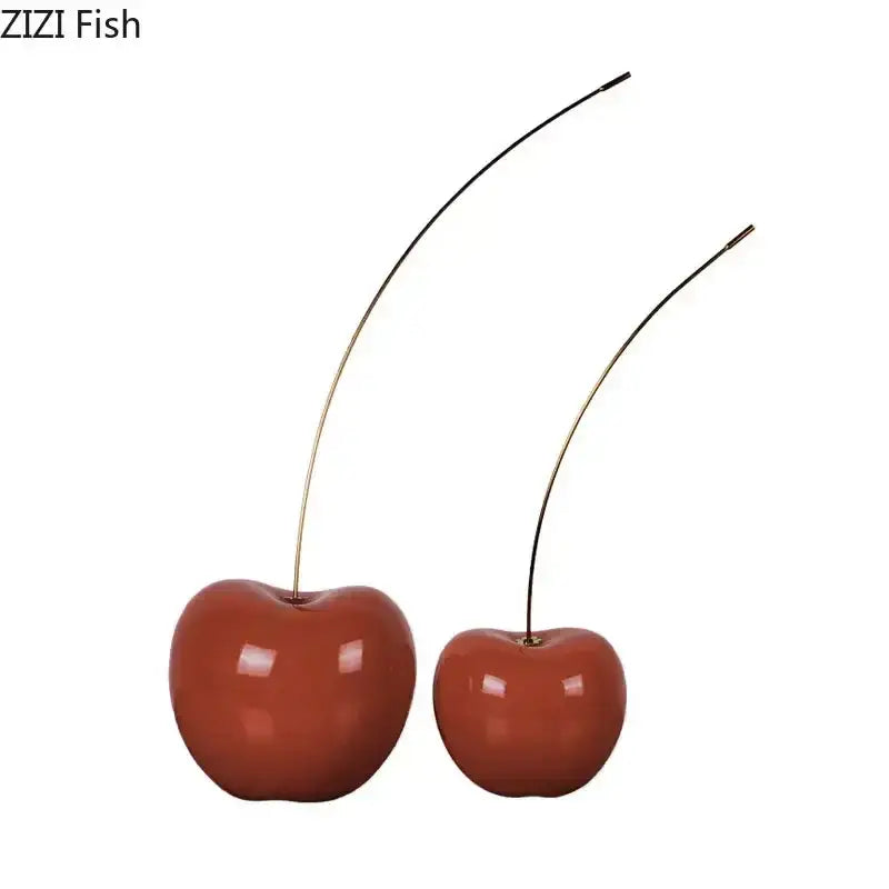 Two glossy reddish-brown ceramic cherry fruit sculpture with slender gold-toned stems for modern home decoration