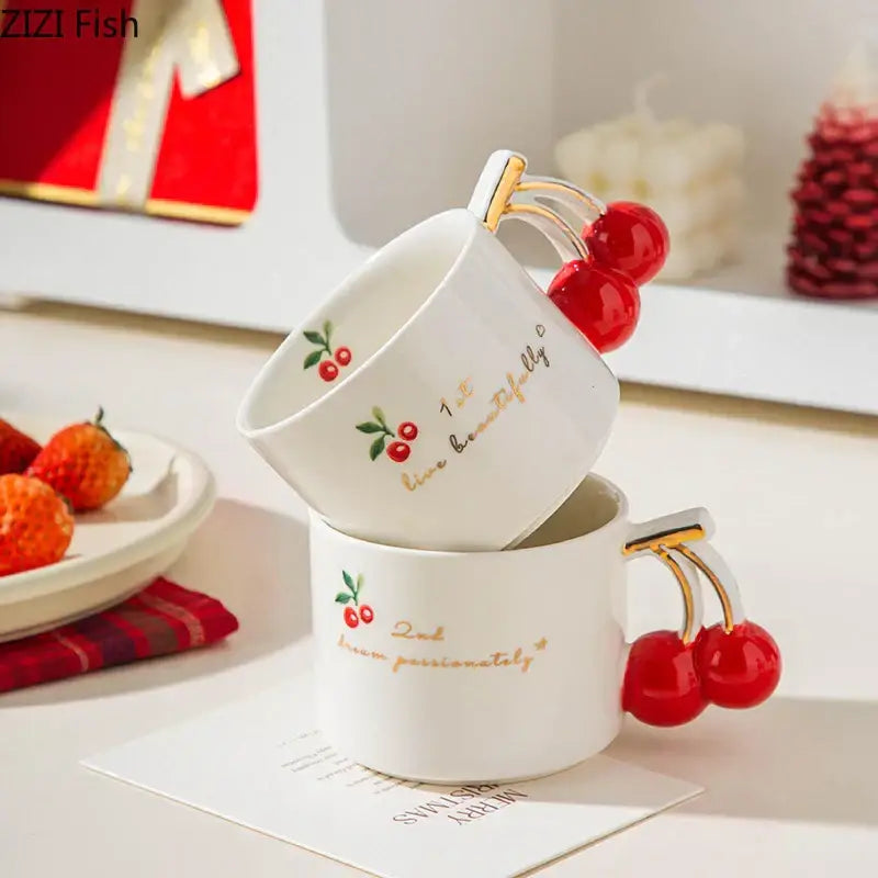 White ceramic DecorBites™ cherry pattern porcelain coffee mug with gold lettering and red cherry handles for tea and juice