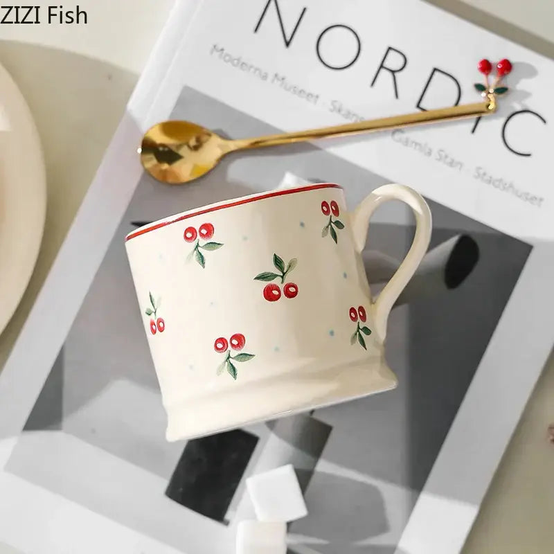 Cream-colored DecorBites™ cherry pattern porcelain coffee mug with lovely cherry illustrations and a thin red rim for tea