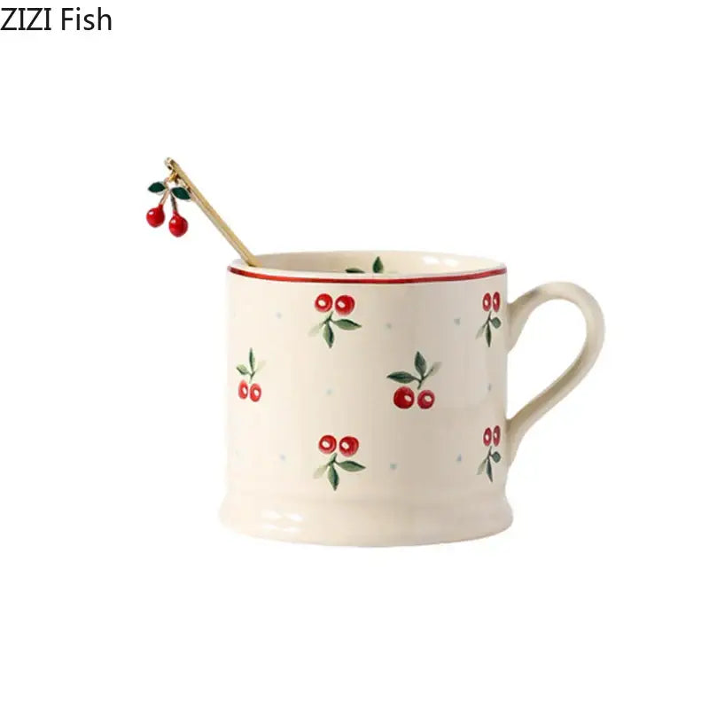Cream-colored decorbites™ cherry pattern porcelain coffee mug with red and green cherry design and thin red rim for afternoon tea