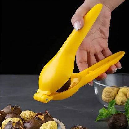 Bright yellow decorbites chestnut clip nutcracker cracking roasted chestnuts for easy shell removal and opening