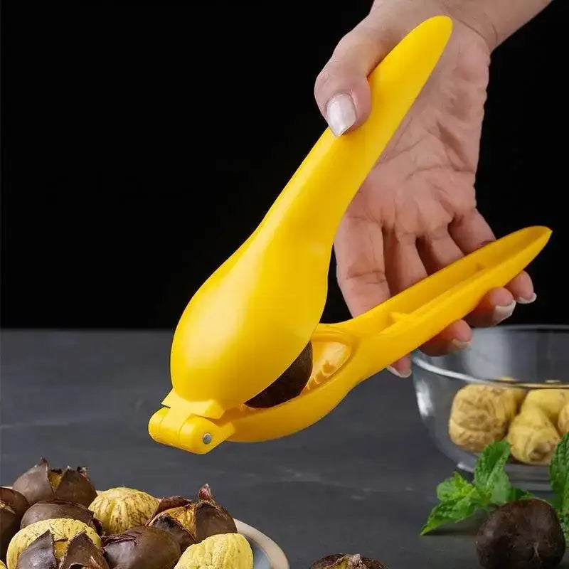 Bright yellow decorbites chestnut clip nutcracker cracking roasted chestnuts for easy shell removal and opening