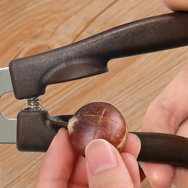Brown plastic-handled decorbites chestnut clip peeler scissors with metal spring mechanism for nut splitting
