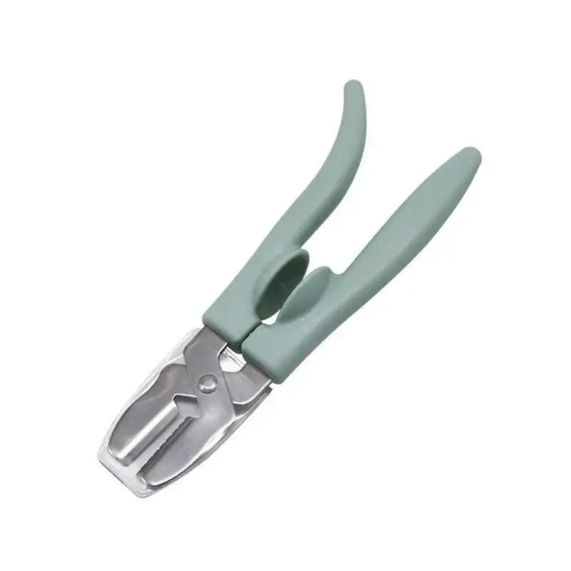 Light green plastic handled chestnut cracker scissors with metallic silver cutting head for cracking nuts by decorbites
