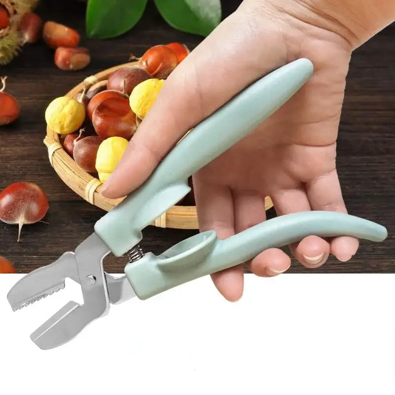 DecorBites chestnut cracker scissors with light green plastic handle and metallic jaws for cracking nuts