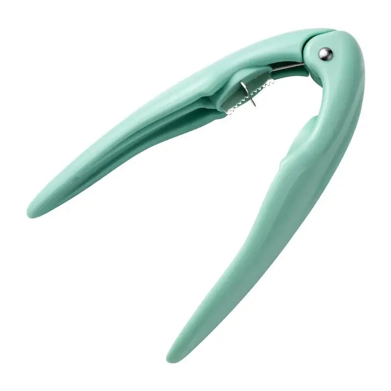 Mint green plastic decorbites chestnut cracker with metallic hinge and spring mechanism for nut opening