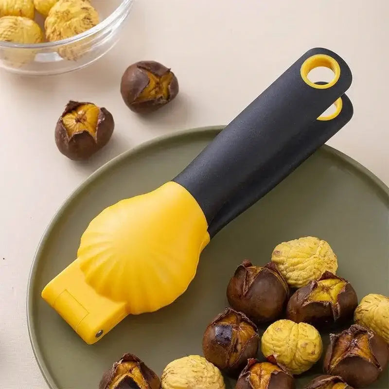 Yellow and black plastic nut cracker with shell-shaped design in decorbites chestnut machine nut cracker set