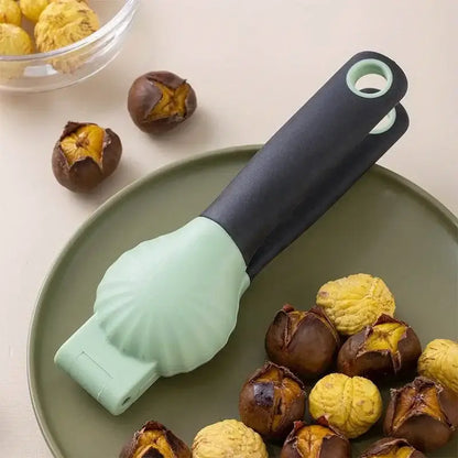 A mint green and black silicone decorbites chestnut machine nut cracker set with a shell-shaped design for easy cracking
