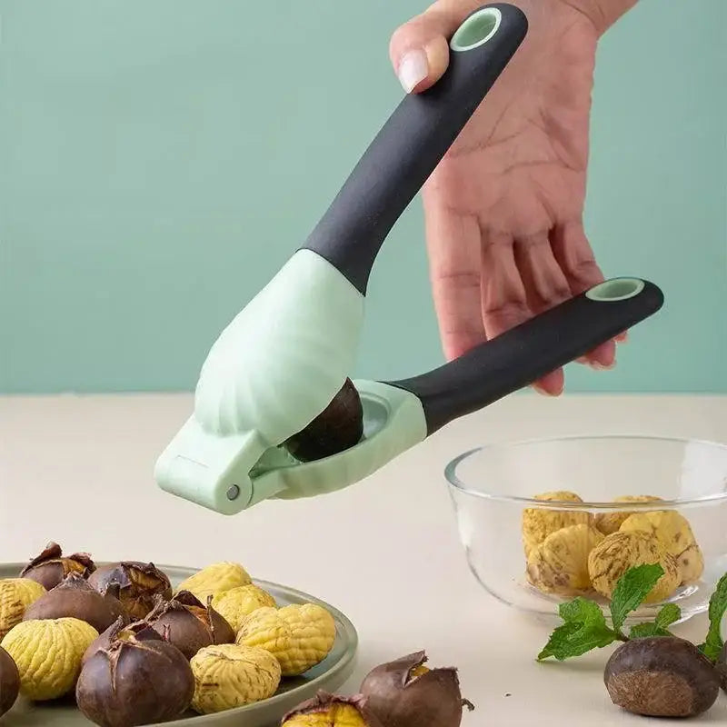 DecorBites chestnut machine nut cracker set with a sleek matte black handle and mint-green body for easy cracking