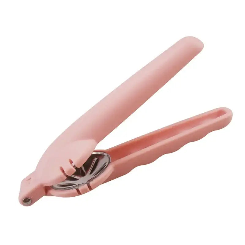 Pink plastic decorbites chestnut opener with metallic star-shaped stainless steel crushing plate tool