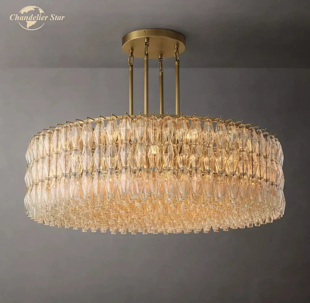 Gold-toned DecorBites Chiara clear glass chandelier with multiple tiers of faceted crystal droplets for living room
