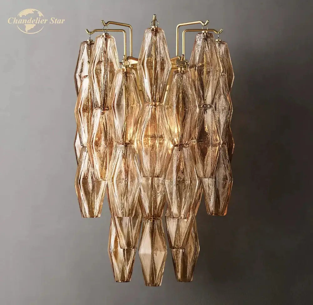 Gold-toned decorbites chiara glass led wall sconce featuring faceted textured glass panels and a brass frame
