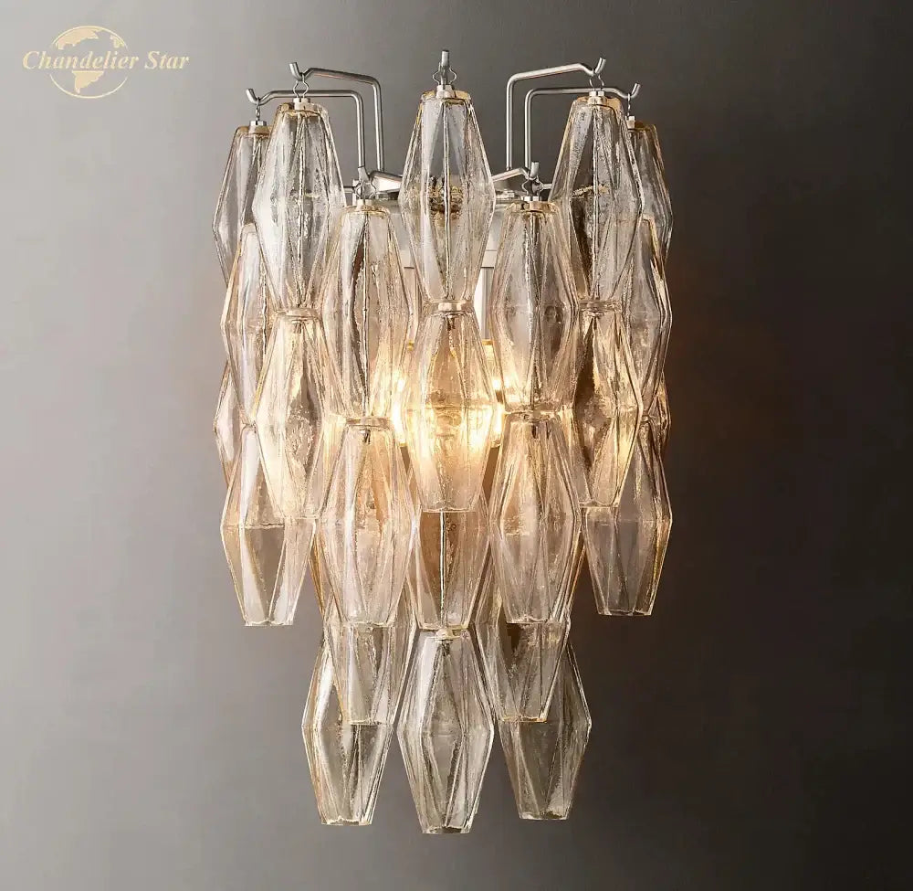 DecorBites™ Chiara glass LED wall sconce with a metallic frame and cascading translucent glass shades catching light