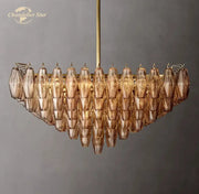 A modern amber glass chandelier with cascading faceted teardrop crystals decorbites chiara glass square led fixture