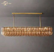 Gold-toned decorbites chiara smoke glass linear chandelier with faceted amber crystals for dining and living room
