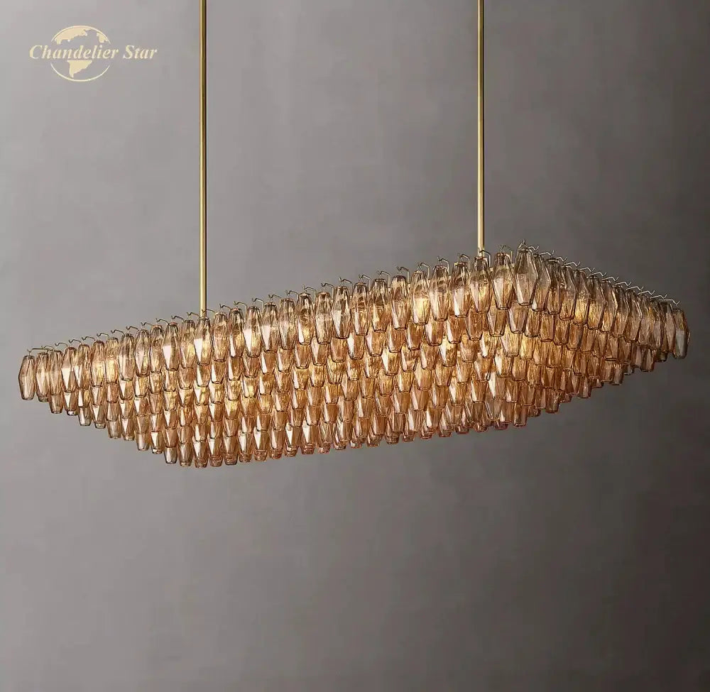 Gold-toned decorbites chiara smoke glass tiered chandelier with amber teardrop elements and brass rods in modern design