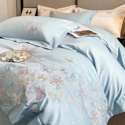 Light blue satin duvet cover with delicate butterfly and floral embroidery in decorbites chic embroidered cotton bedding set