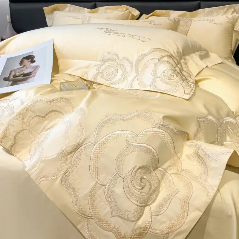 Cream-colored satin bedding set with intricate silver-threaded rose embroidery by decorbites chic embroidered cotton