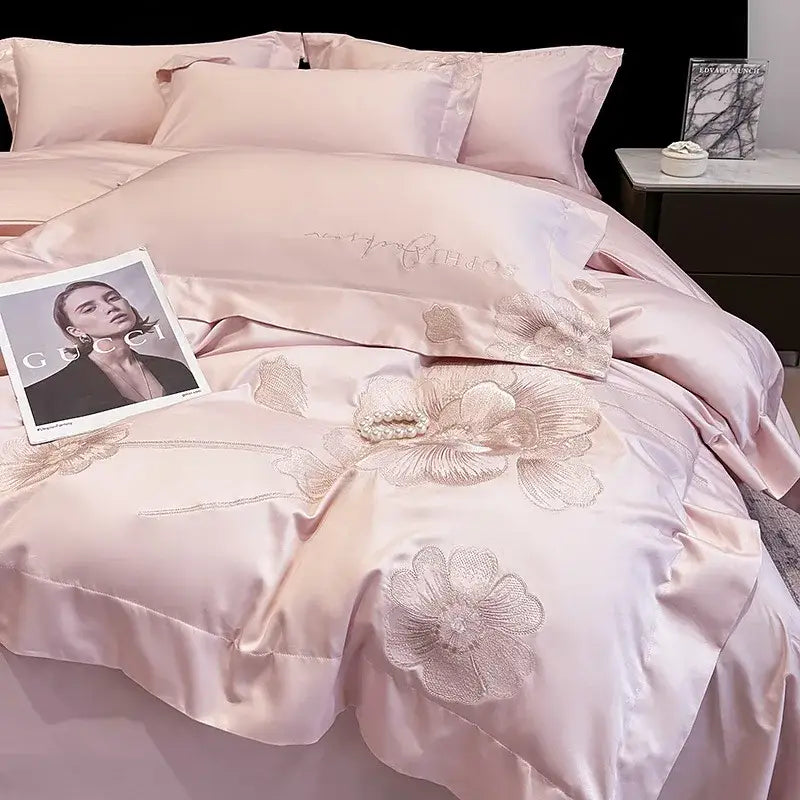 Luxurious blush pink satin decorbites chic embroidered cotton bedding set with gold-threaded floral embroidery and pearl accent
