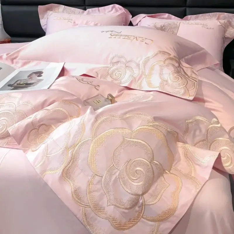 Pink satin bedding set with gold-threaded floral embroidery from DecorBites™ chic embroidered cotton collection for luxury