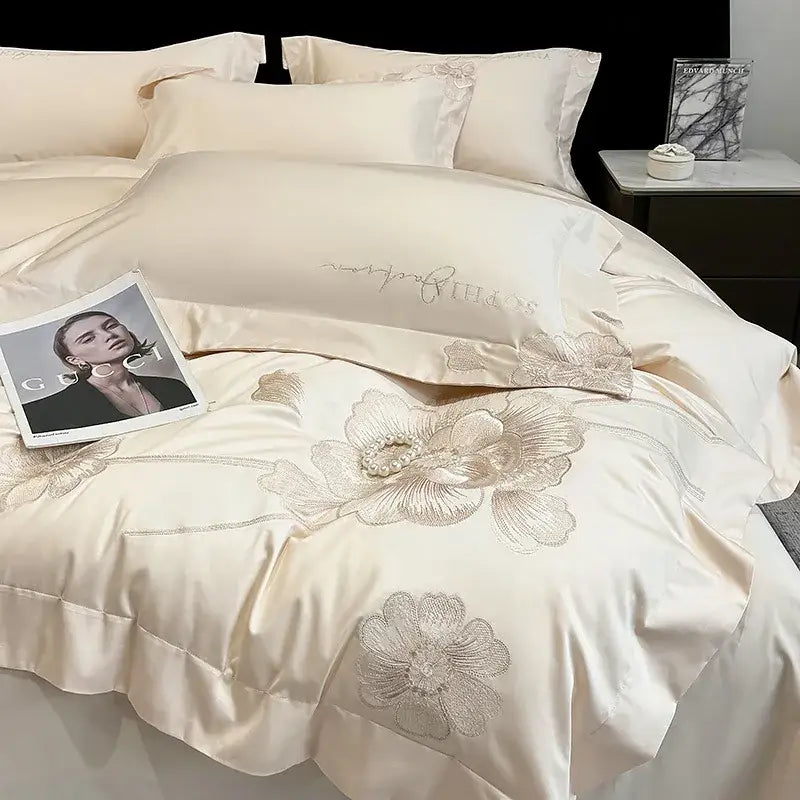 Cream-colored decorbites chic embroidered bedding set with silver floral embroidery and pearl accents in cotton for luxury decor