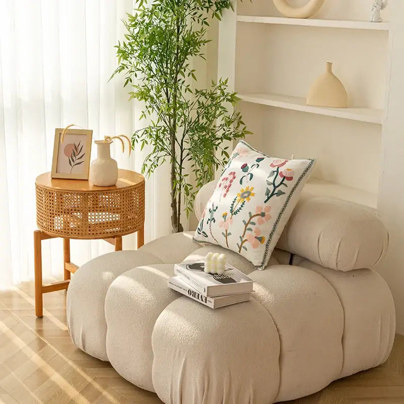 Beige cloud-shaped pouf with decorbites chic floral geometric cushion cover featuring floral embroidery