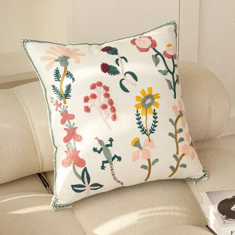 White square cushion cover with colorful embroidered flowers and green lizard by decorbites chic floral geometric design