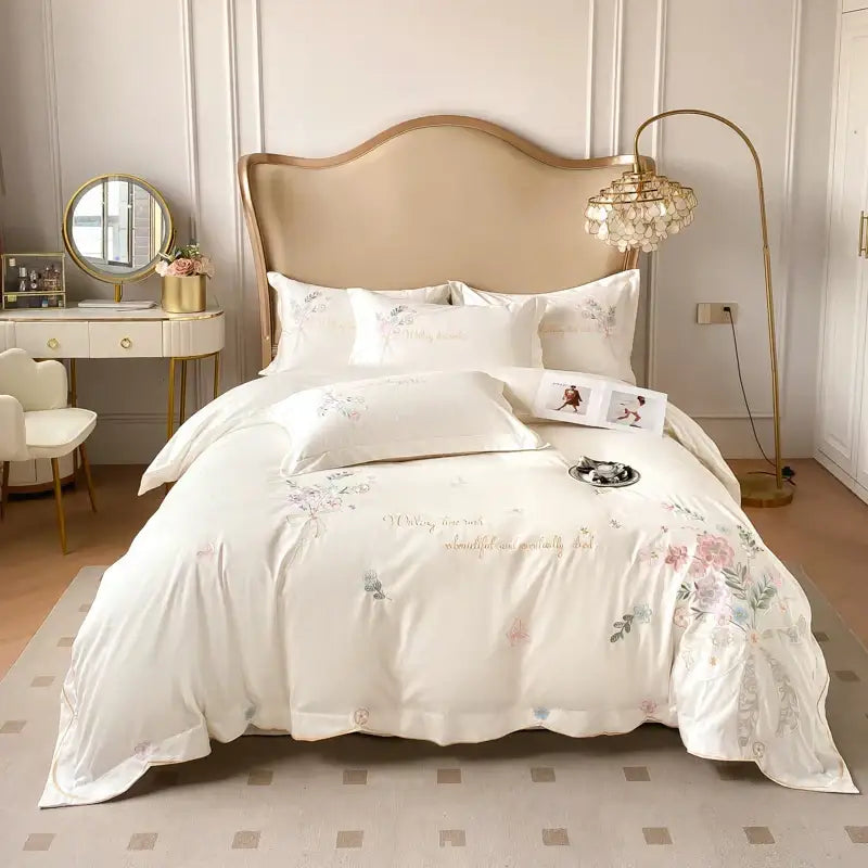Elegant ivory satin bedding set with chic flowers embroidery and soft pastel accents by DecorBites 100% cotton 400TC