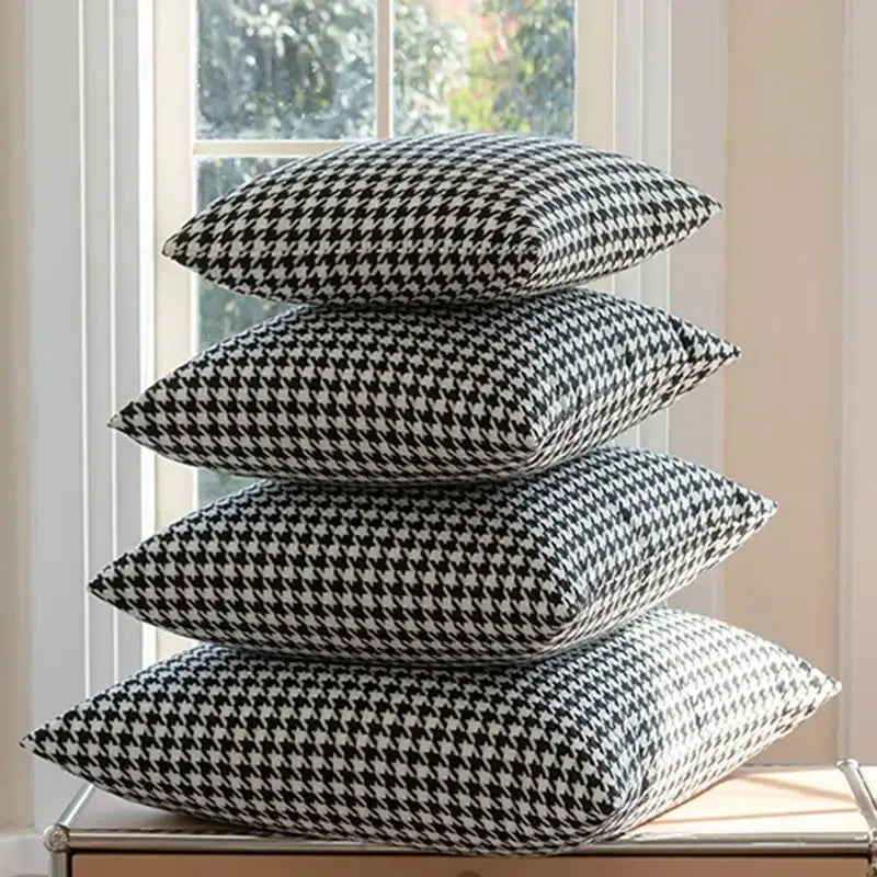 Stack of four black and white decorbites chic houndstooth cushion covers for modern home decor