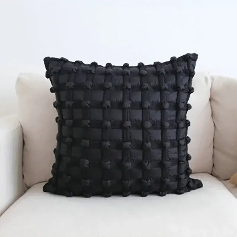 Black quilted decorbites chic pillow with textured grid pattern of raised pom-poms in chic pillow cover set