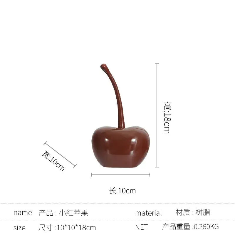 A glossy deep red cherry-shaped resin ornament from decorbites chic red cherries for home decor and table accessories