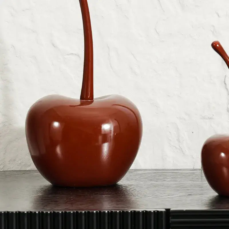 Glossy deep red resin ornament with long slender stem from decorbites chic red cherries for home decor and table accessories