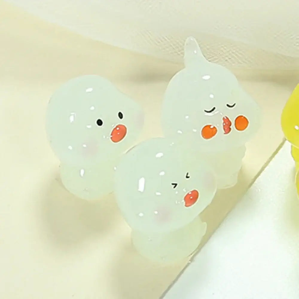 Three translucent white decorbites chick doll figurines with orange beaks and unique expressions for miniature decor