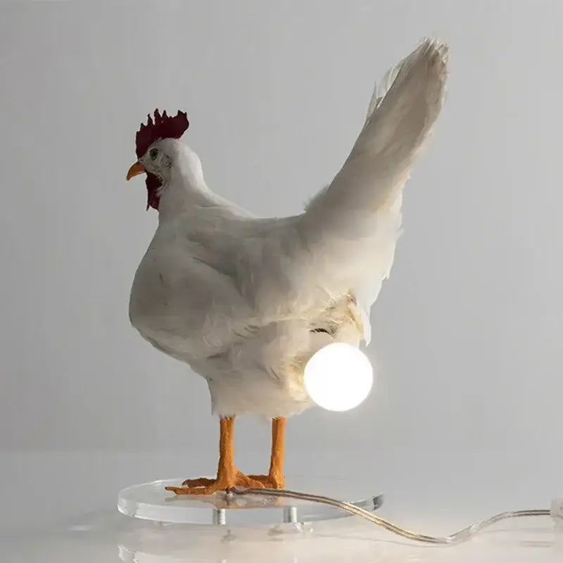 DecorBites™ white chicken-shaped night light ornament with red comb, orange legs, and glowing spherical bulb for home decor