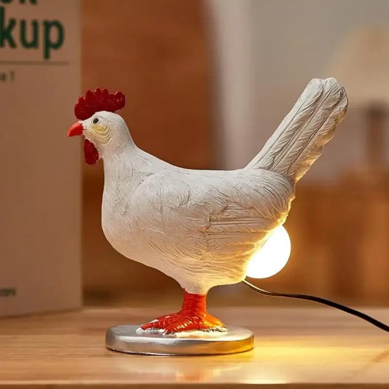 White chicken-shaped decorbites™ chick night light ornament with red comb and feet textured plastic body silver base light ornament