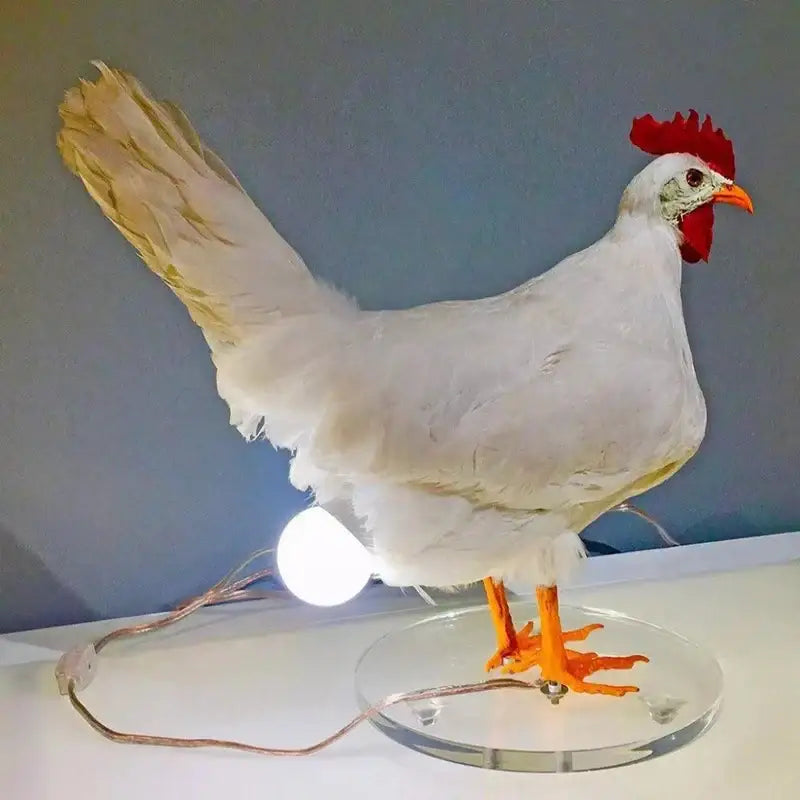 DecorBites™ chick night light ornament is a white chicken-shaped light ornament with red comb and orange beak on clear base
